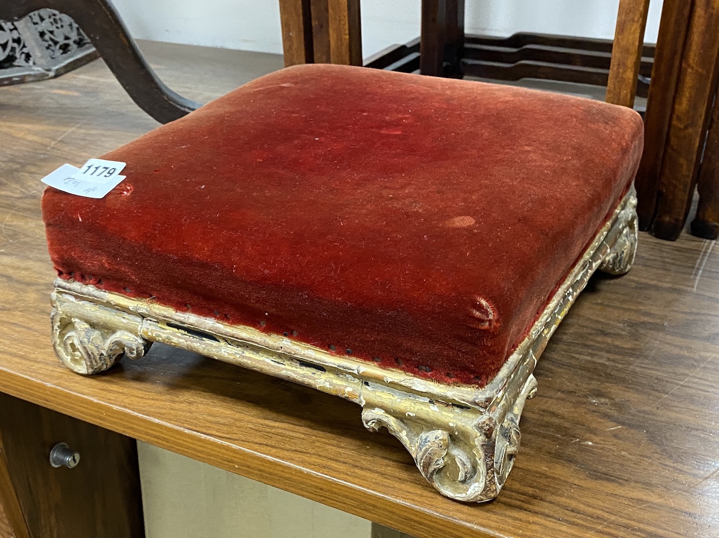 A Victorian carved giltwood foot stool, width 33cm, height 13cm